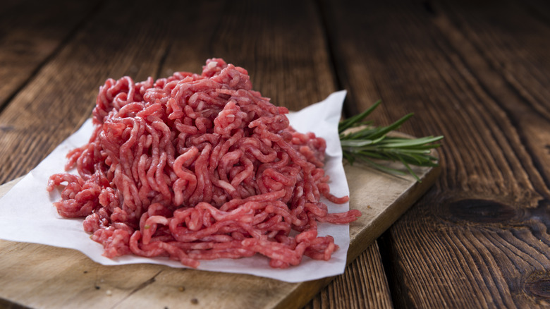 Ground beef on wood board