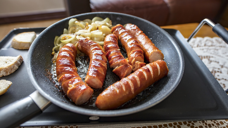 Polish kielbasa sausages in pan