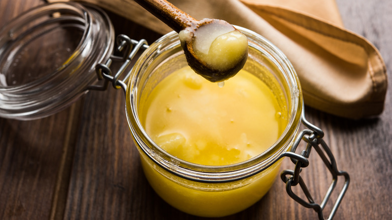 clarified butter in jar with spoon