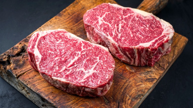 beef with marbling on board