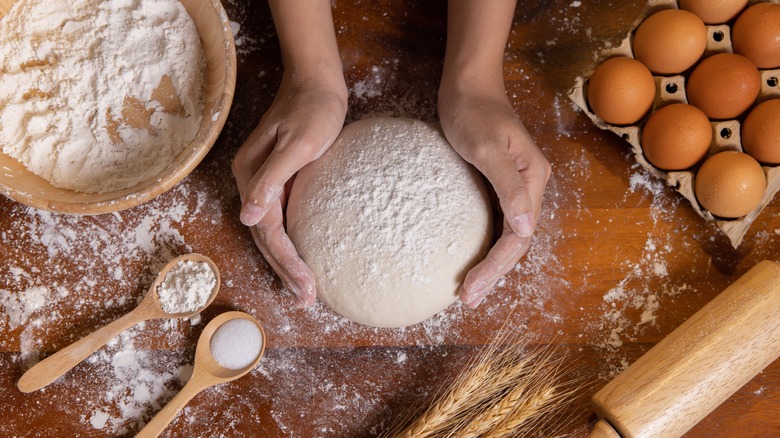 hand wrapped around dough