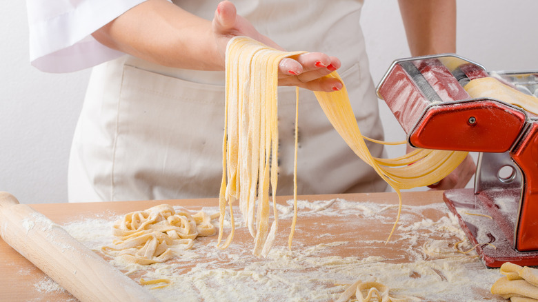 chef making long pasta