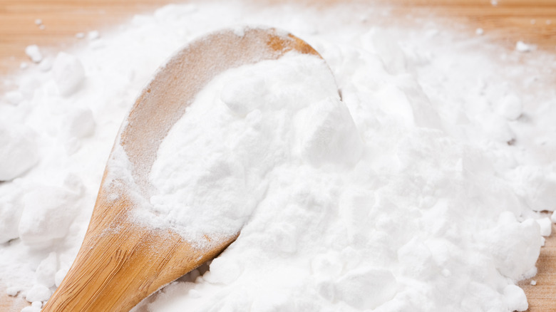 spoon in baking soda pile