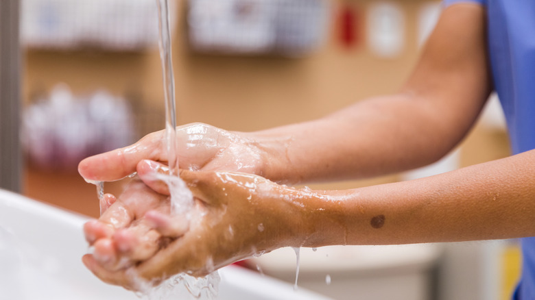 person washing their hands