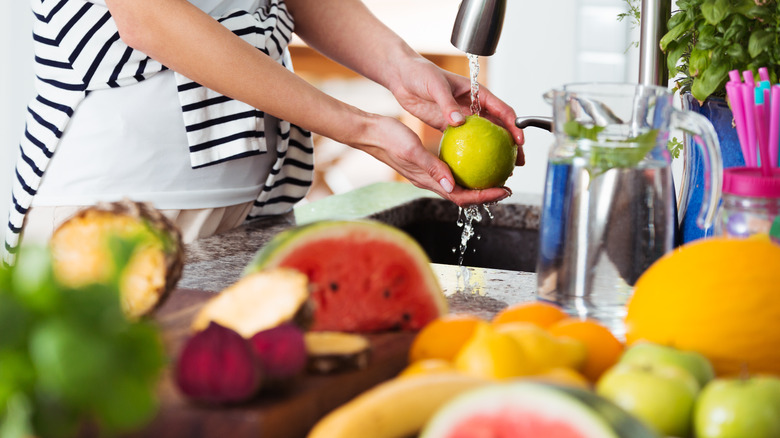 woman washing fruits