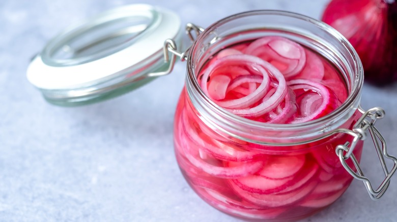 Pickled red onions in glass jar