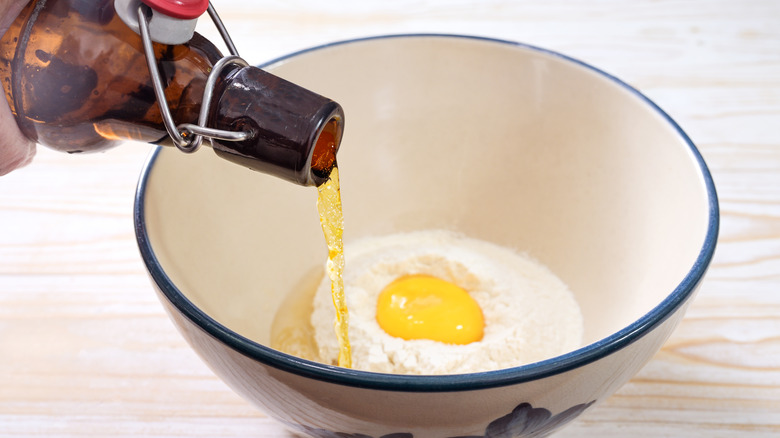 Beer pouring into flour