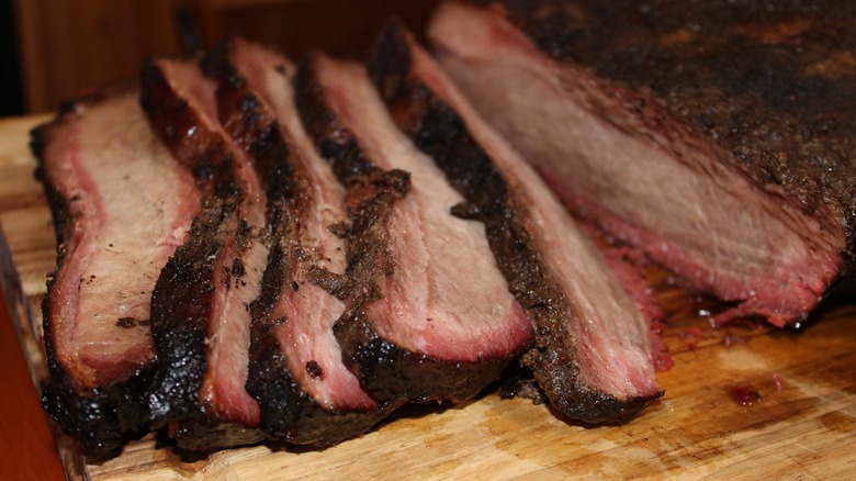 sliced brisket on butcher's block