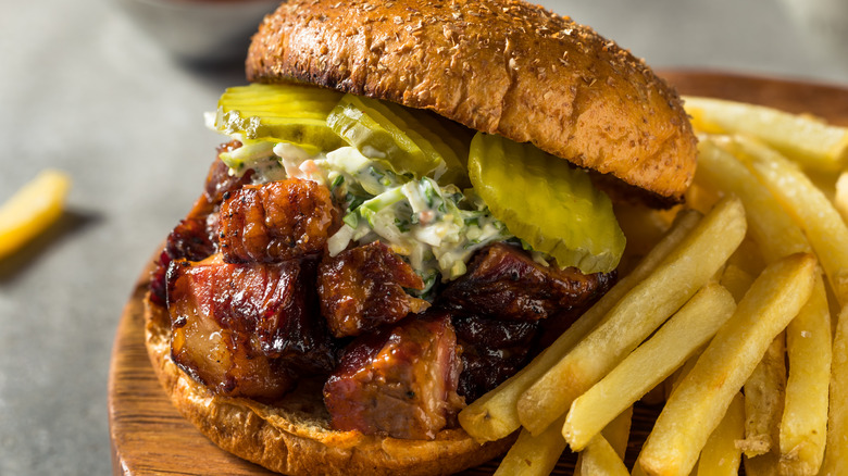 Barbecue burnt ends sandwich with fries