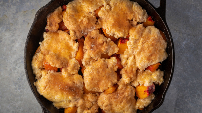 peach cobbler in cast iron skillet