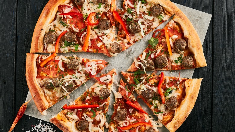 homemade pizza with meat and peppers