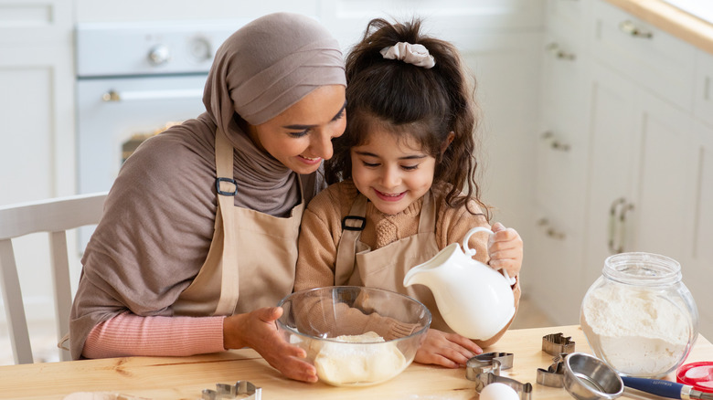 mother and daughter cooking