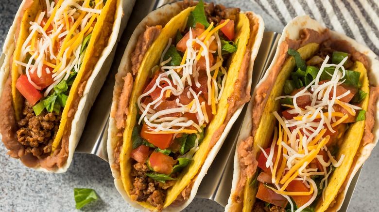 three double decker stuffed tacos