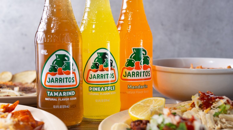 three bottles of different flavored Jarritos