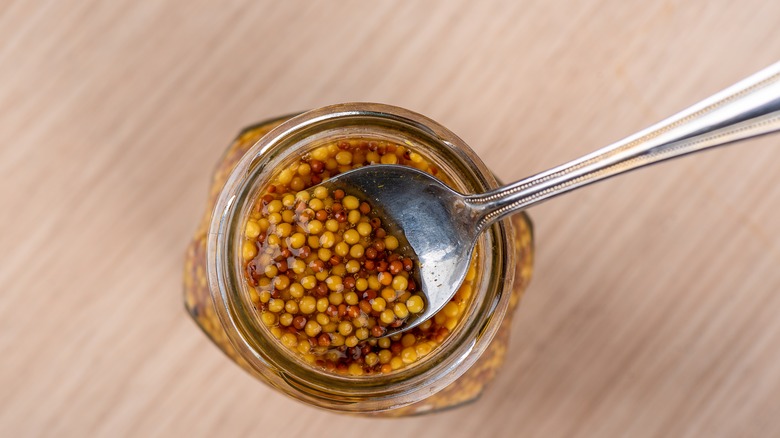 Mustard seeds on spoon