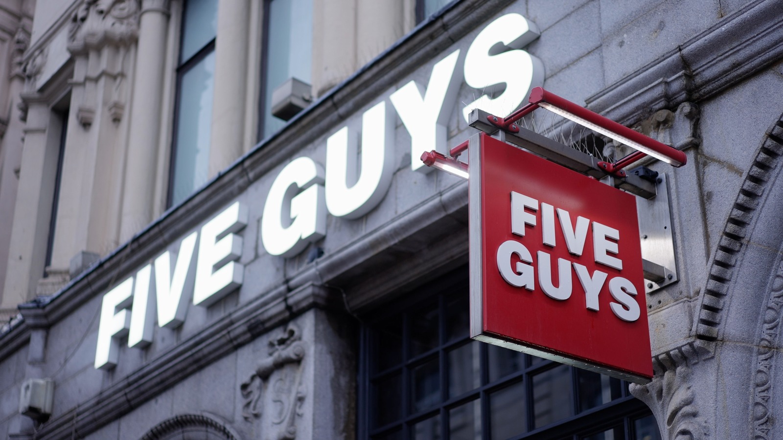 The Real Reason You Always See Bags Of Potatoes Inside Five Guys