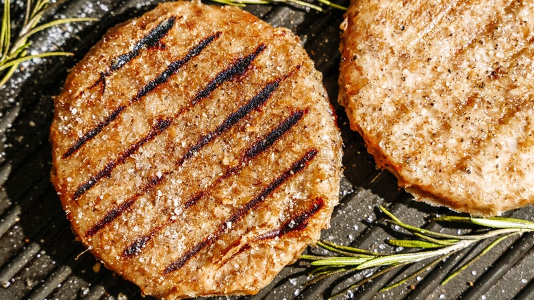 two vegan burgers on grill