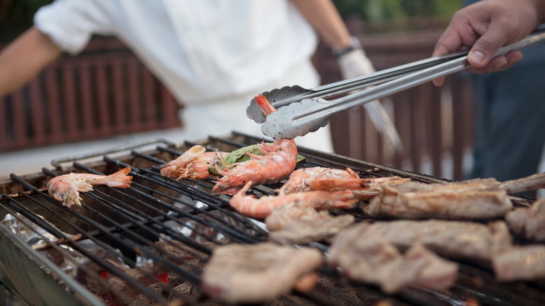 Shrimp cooking on grill