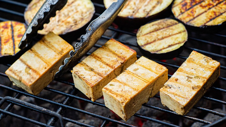 Firm tofu chunks on grill