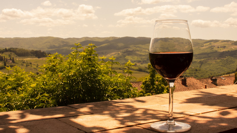 glass of wine with hills
