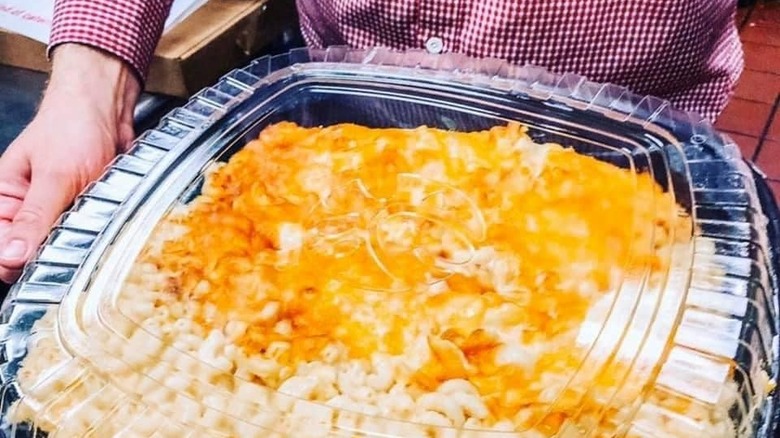 Mac & Cheese Tray being held