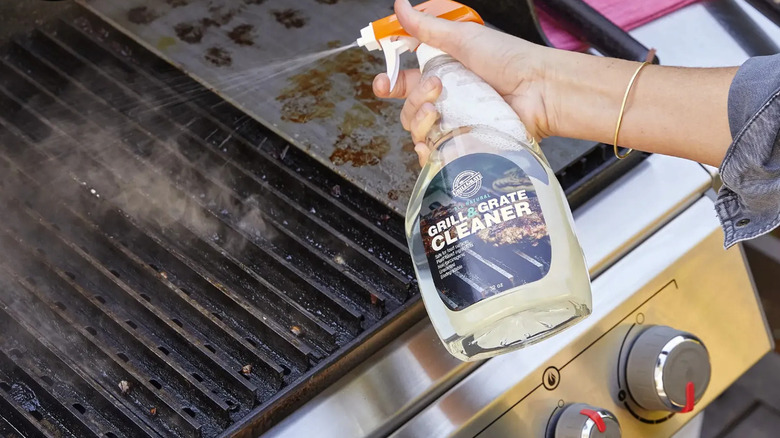Spraying a degreaser for grill