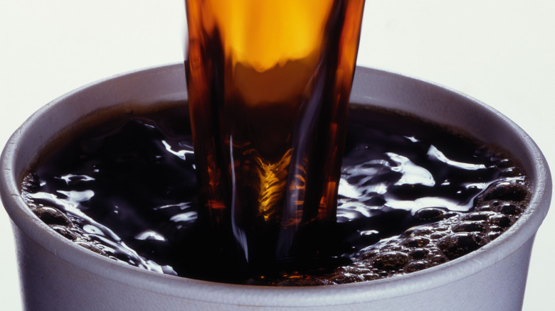 coffee being poured into cup