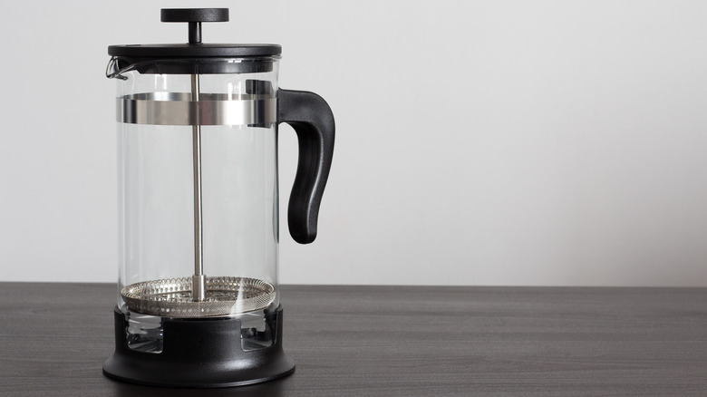 empty french press on table