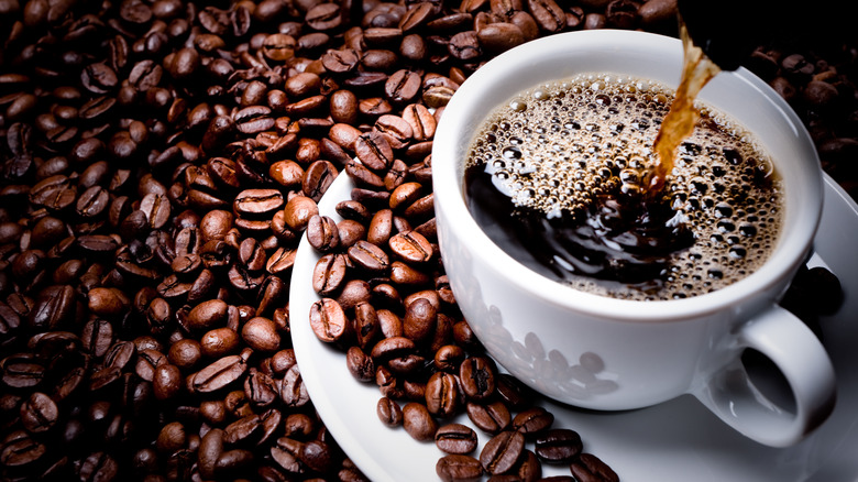 cup of coffee on beans