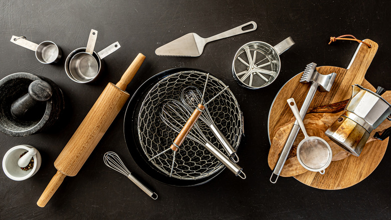 array of kitchen tools left on table