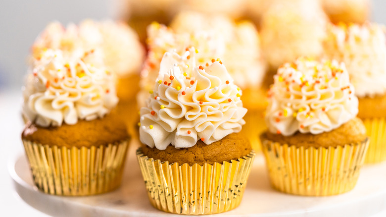 orange cupcakes in gold foil