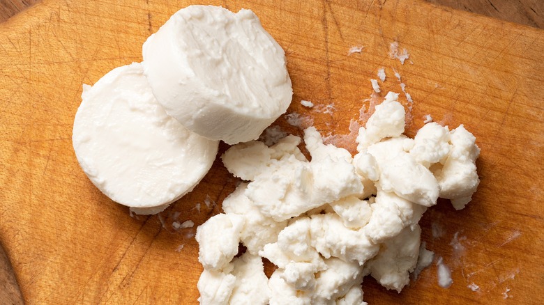 Goat cheese on cutting board