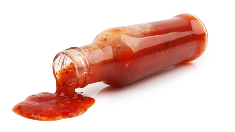 Hot sauce pouring out of bottle