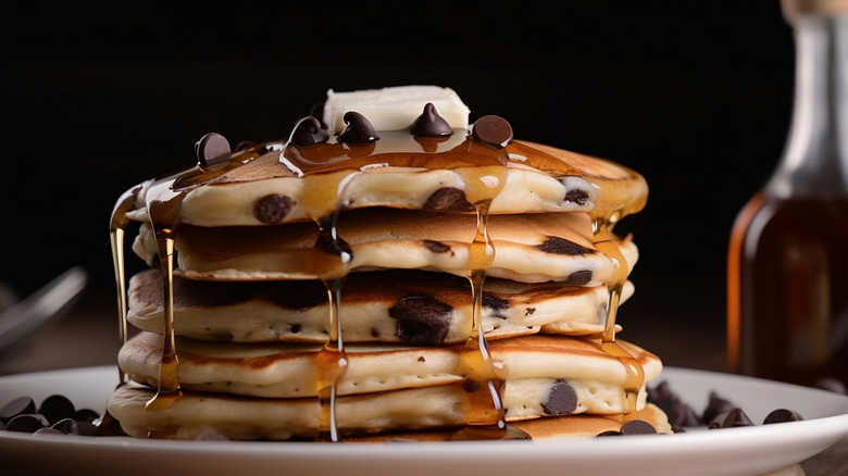 Chocolate chip pancakes, drizzled with maple syrup