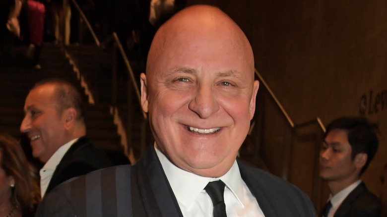 Aldo Zilli smiling in suit