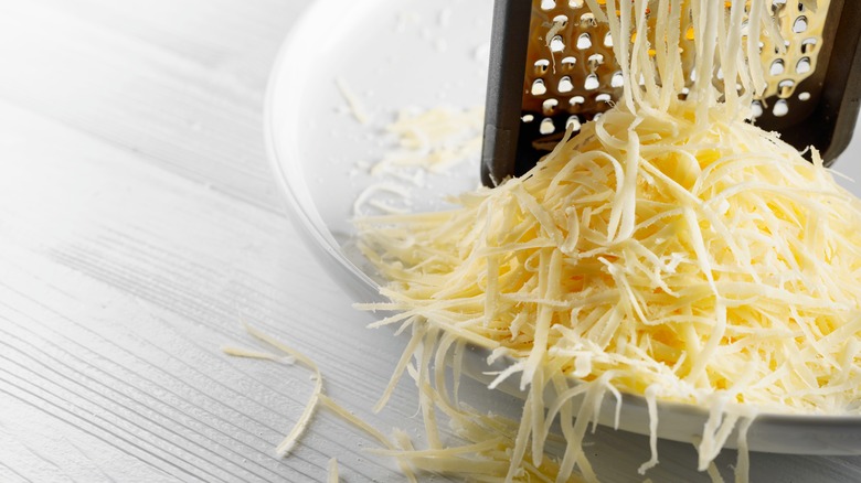 Cheese being grated