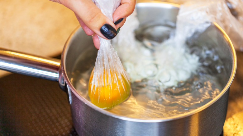 bagged egg in boiling pot