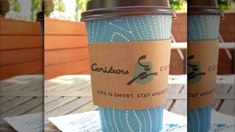 Caribou coffee cup on table