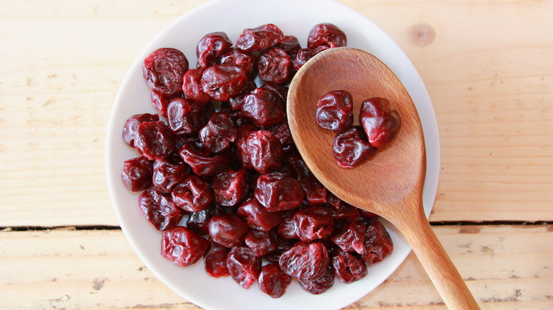 dried cherries in white bowl