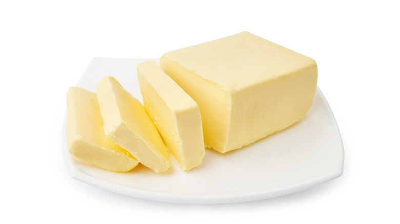 Sliced butter on plate