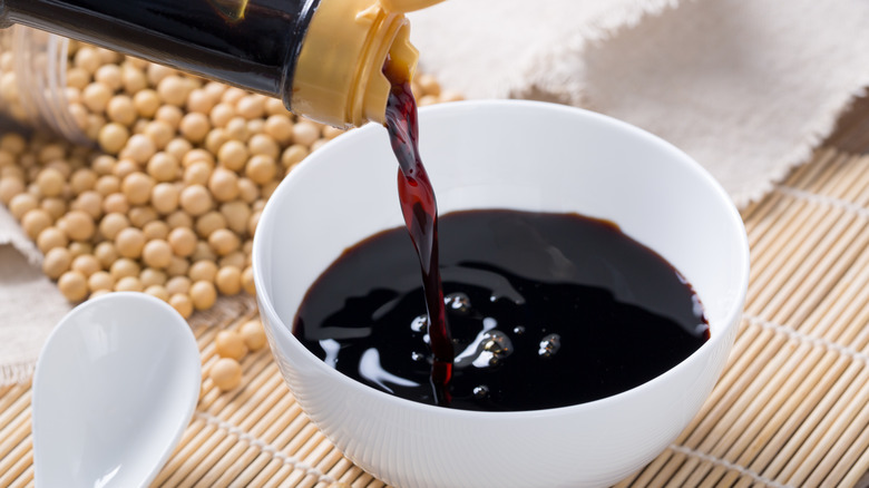 Soy sauce pouring in cup
