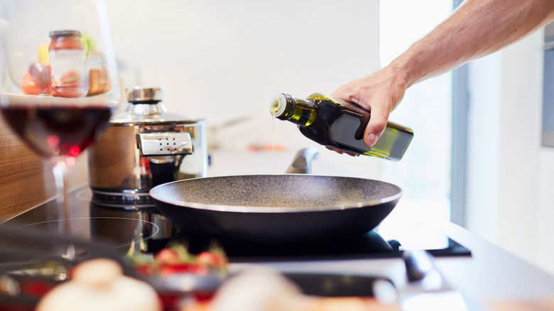 Adding oil into pan