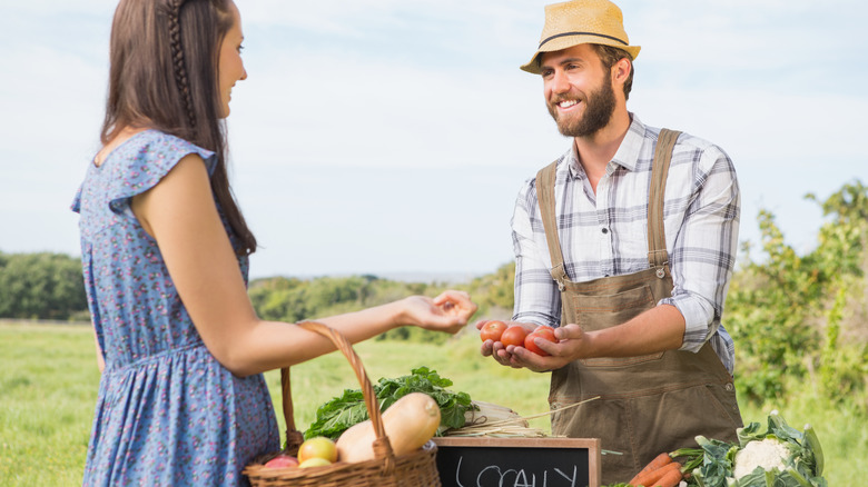 shopper talking with farmer