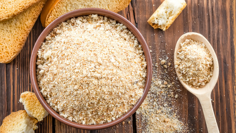 Bread crumbs in bowl and spoon