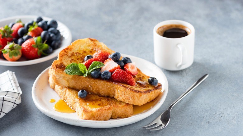 French toast on a plate with fruit