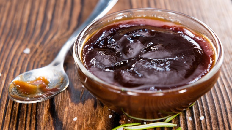 Barbecue sauce on wooden table