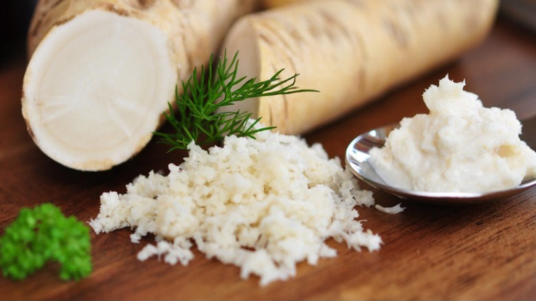 Grated horseradish on table