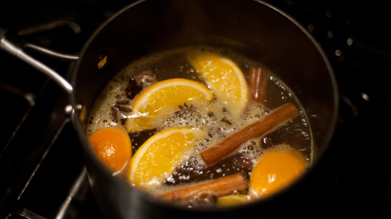 a pot of alcohol heated with fruit and spices