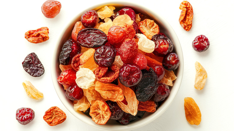 a bowl of various dried fruits