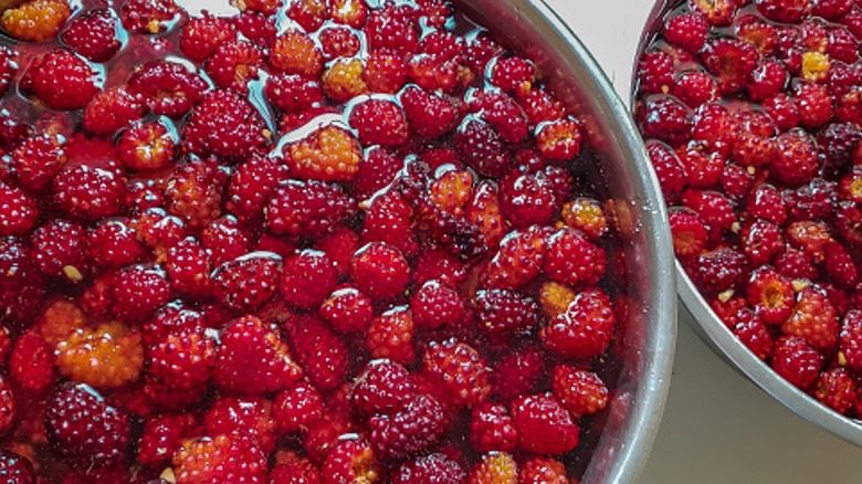 a bowls of berries soaking in liquid